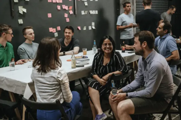 Several groups of people sitting and talking to each other