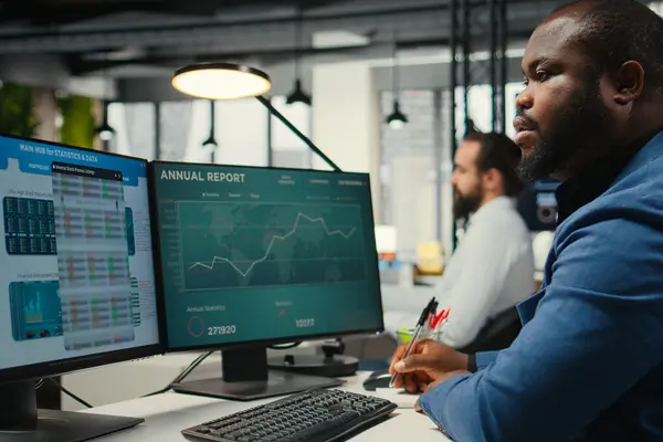 Workstation in an airline operations control center with dashboards for monitoring and controlling flight operations