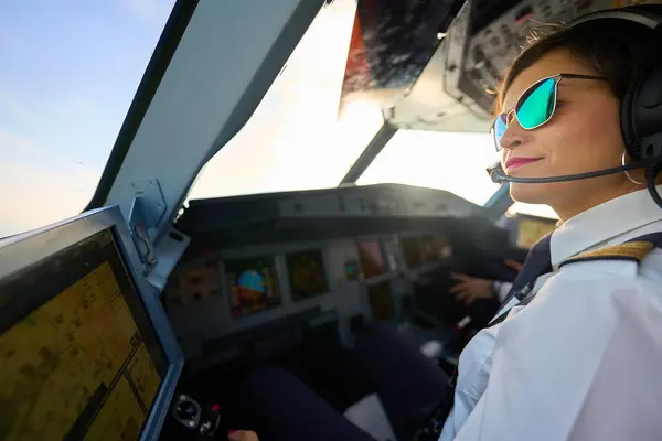 female pilot in cockpit