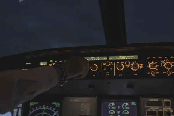 Interaction with the overhead panel in the cockpit to control aircraft systems during operations