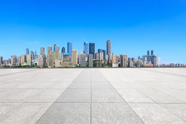 Wide urban space with a modern city skyline