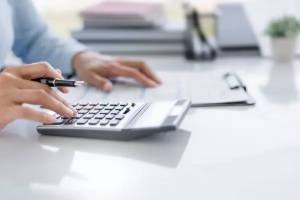 Calculator and documents on a desk