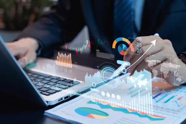 Investment and finance growth concept. Businessman analyzing money, profit, income, and financial data for economic success, business development, and long-term investment strategy.