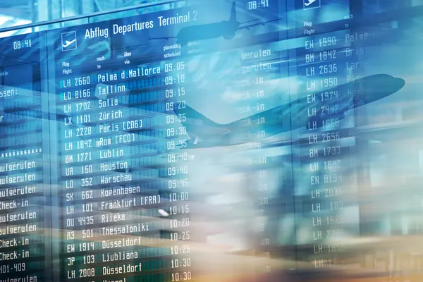Airport departure board displaying flight schedules and destinations