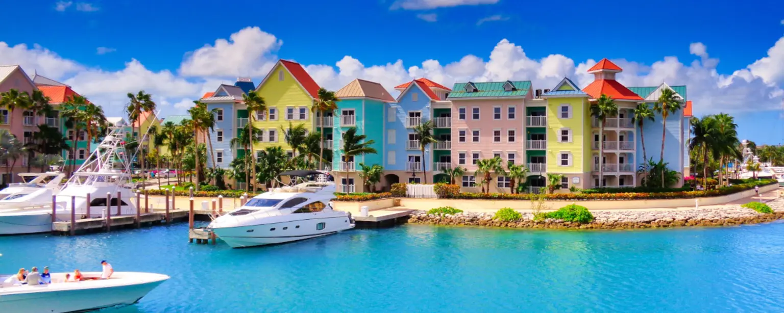 Houses by the water and boats in Nassau, Bahamas.