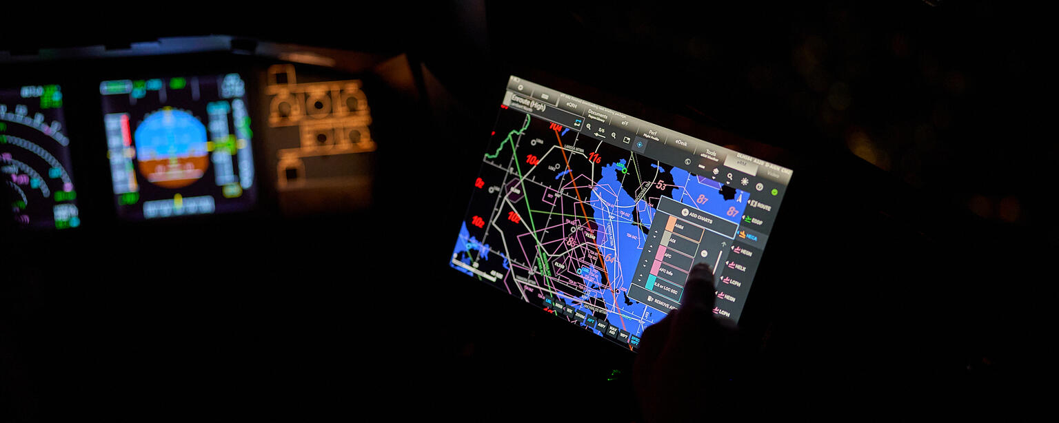 Screens at night in airplane cockpit with Lido eRoute Manual