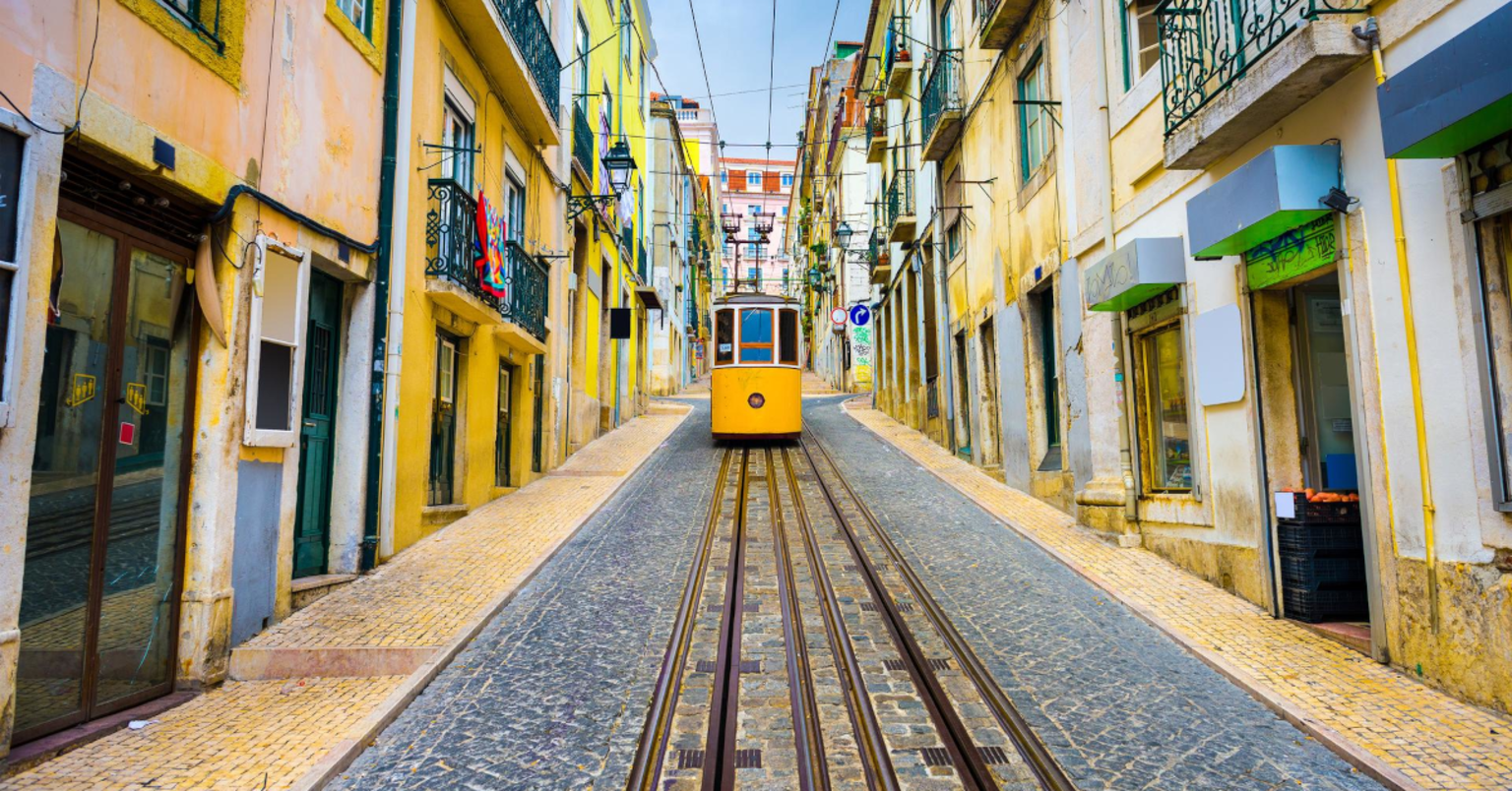 Yellow streetcar in the streets of Lisbon